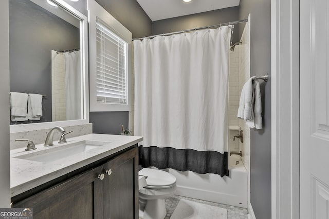 bathroom featuring toilet, vanity, and shower / bath combo with shower curtain