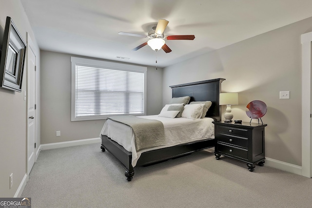 bedroom with carpet flooring, baseboards, and a ceiling fan