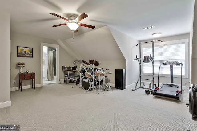 workout room with a ceiling fan, carpet, lofted ceiling, and baseboards