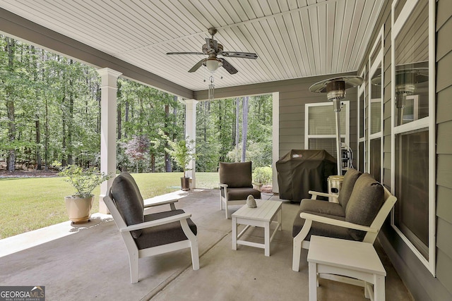 view of patio with ceiling fan, grilling area, and an outdoor living space