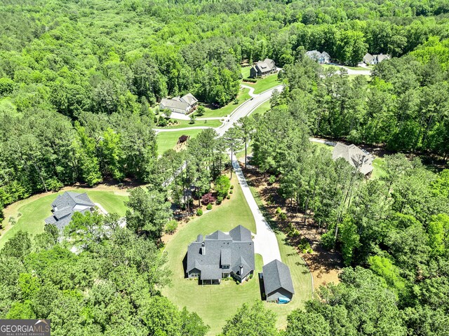 drone / aerial view of a heavily wooded area