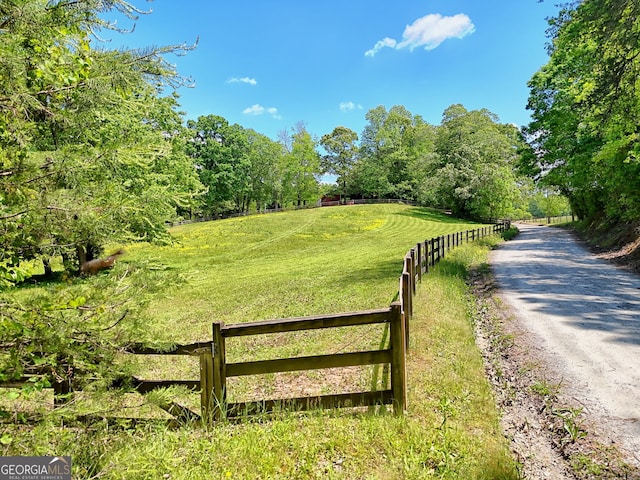 gate featuring fence and a view of countryside