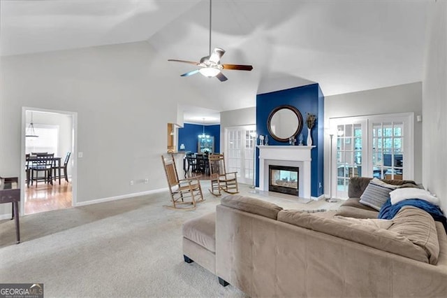 10 Bayberry Ct, Acworth, GA 30101 - living room with a ceiling fan, carpet, baseboards, a glass covered fireplace, and a chandelier