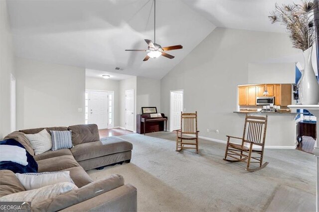 10 Bayberry Ct, Acworth, GA 30101 - carpeted living area with high vaulted ceiling, a ceiling fan, and baseboards