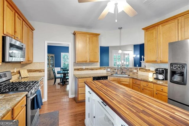 10 Bayberry Ct, Acworth, GA 30101 - kitchen featuring stainless steel appliances, wooden counters, a sink, and decorative backsplash