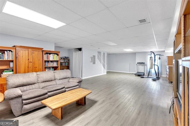 10 Bayberry Ct, Acworth, GA 30101 - living area featuring baseboards, light wood-style floors, and a drop ceiling