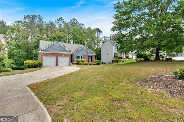 10 Bayberry Ct, Acworth, GA 30101 - view of front facade with driveway, a garage, a front yard, and brick siding