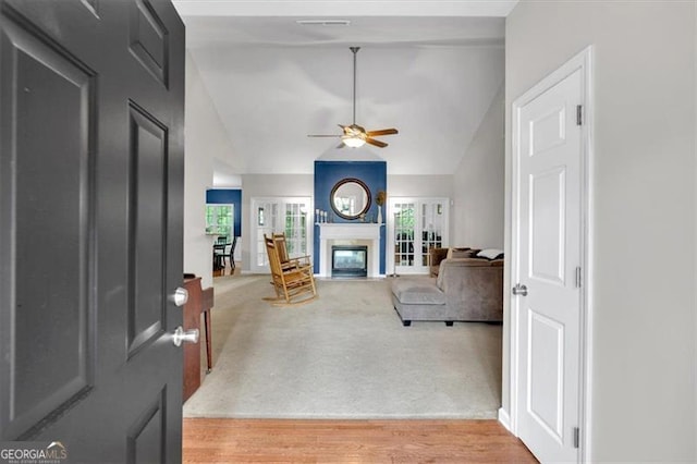 10 Bayberry Ct, Acworth, GA 30101 - carpeted living room featuring lofted ceiling, ceiling fan, and a glass covered fireplace