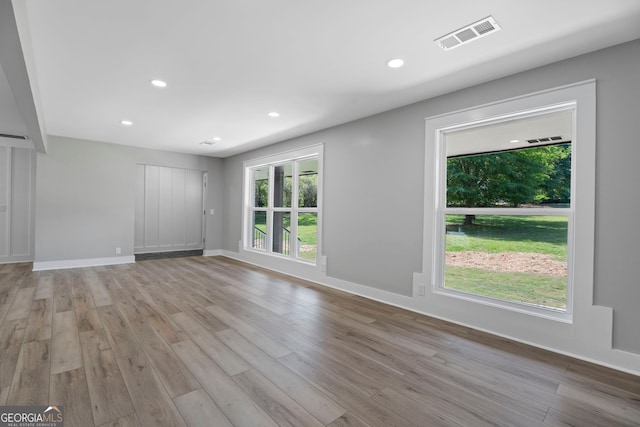 2604 Flat Shoals Rd SW, Conyers, GA 30094 - unfurnished living room with wood finished floors, recessed lighting, and baseboards