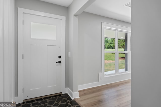 2604 Flat Shoals Rd SW, Conyers, GA 30094 - foyer with wood finished floors and baseboards