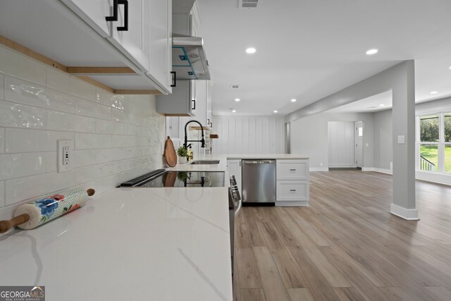 2604 Flat Shoals Rd SW, Conyers, GA 30094 - kitchen with stainless steel dishwasher, white cabinetry, a sink, backsplash, and recessed lighting