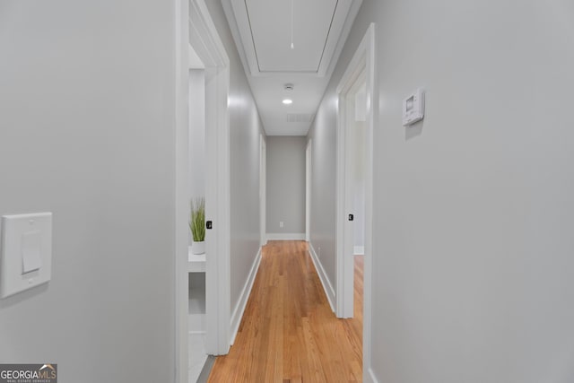 2604 Flat Shoals Rd SW, Conyers, GA 30094 - corridor with attic access, light wood-style floors, and baseboards