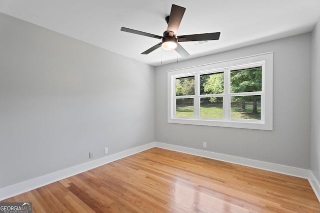 2604 Flat Shoals Rd SW, Conyers, GA 30094 - empty room with baseboards, light wood-style floors, and ceiling fan