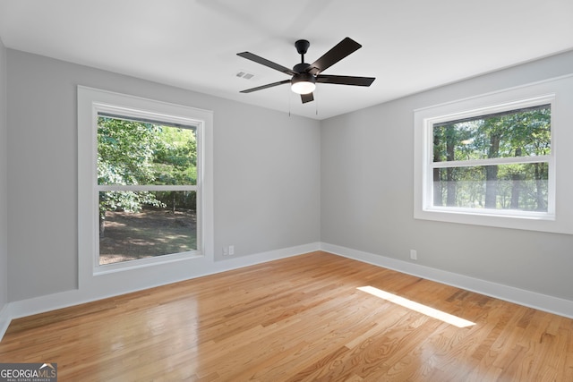 2604 Flat Shoals Rd SW, Conyers, GA 30094 - spare room featuring wood finished floors, baseboards, and ceiling fan