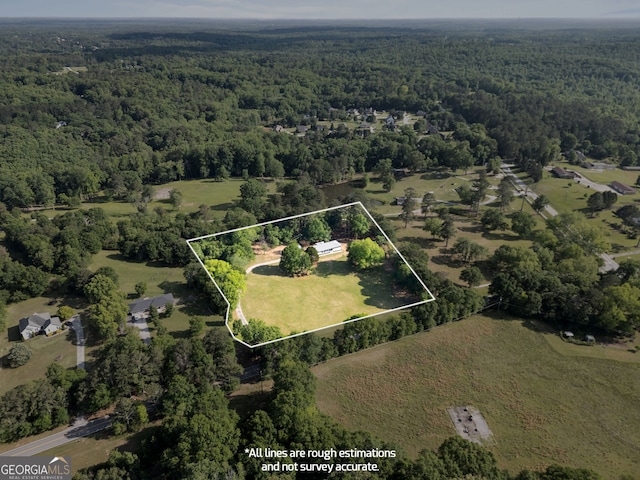 2604 Flat Shoals Rd SW, Conyers, GA 30094 - aerial view of property and surrounding area with a heavily wooded area and property boundaries highlighted