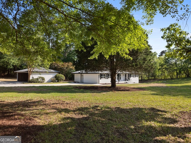 2604 Flat Shoals Rd SW, Conyers, GA 30094 - view of front facade featuring a front yard and concrete driveway