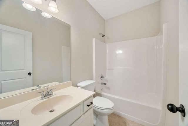 bathroom featuring toilet, vanity, shower / bath combination, and tile patterned floors