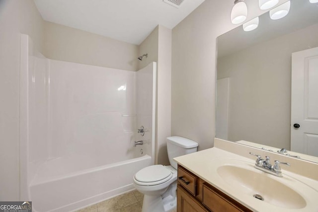bathroom featuring toilet, bathtub / shower combination, vanity, and tile patterned floors