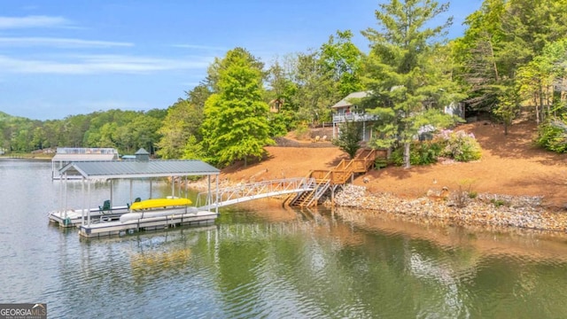 dock area with a water view and stairs