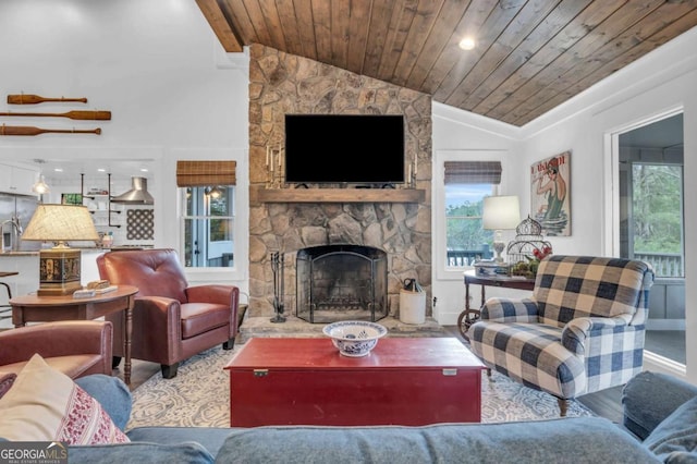 living area with wooden ceiling, lofted ceiling, a fireplace, baseboards, and wood finished floors