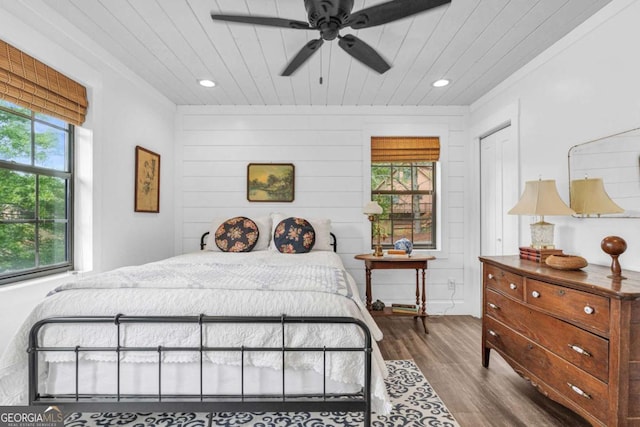 bedroom with wood finished floors, wooden ceiling, recessed lighting, and a ceiling fan
