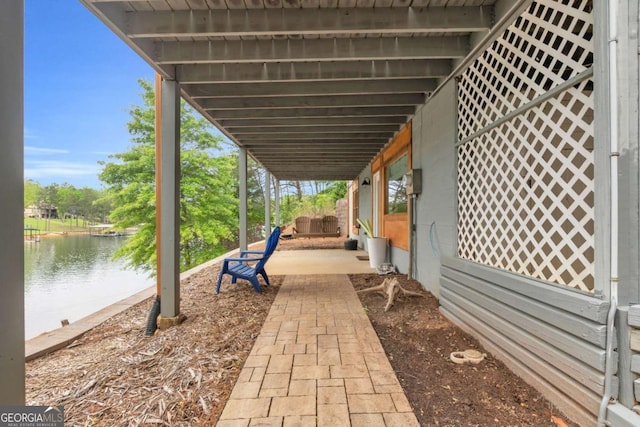 view of patio / terrace with a water view