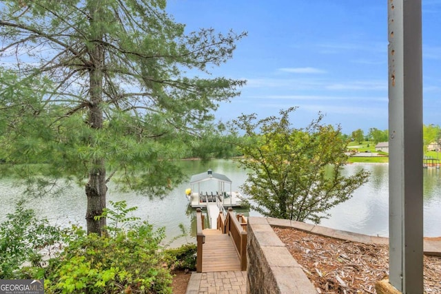 dock area featuring a water view