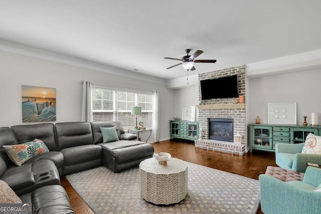 4050 Pleasant Woods Dr, Cumming, GA 30028 - living area with a ceiling fan, wood finished floors, ornamental molding, and a fireplace