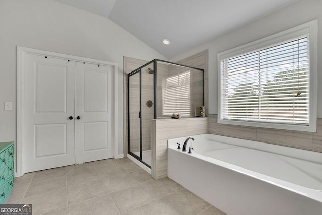 4050 Pleasant Woods Dr, Cumming, GA 30028 - bathroom featuring lofted ceiling, a garden tub, a stall shower, and tile patterned flooring