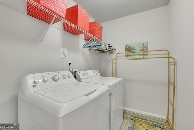 4050 Pleasant Woods Dr, Cumming, GA 30028 - washroom with separate washer and dryer and tile patterned floors