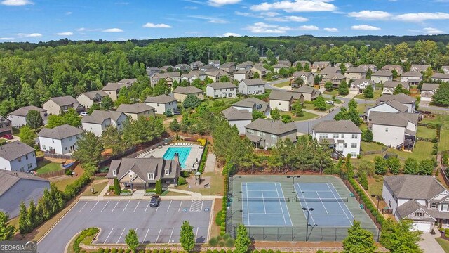 4050 Pleasant Woods Dr, Cumming, GA 30028 - aerial overview of property's location featuring a pool area and nearby suburban area