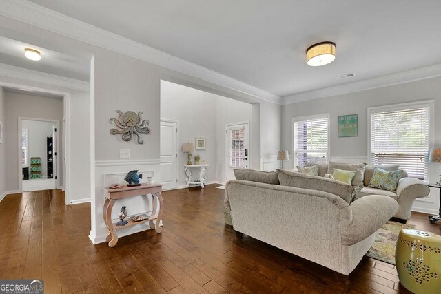 4050 Pleasant Woods Dr, Cumming, GA 30028 - living room with ornamental molding, dark wood-style floors, and a wainscoted wall