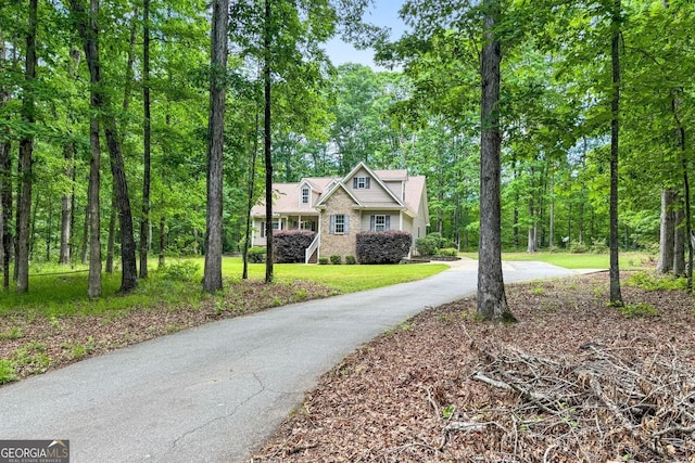 84 Creekside Ct, Zebulon, GA 30295 - view of front of house featuring asphalt driveway and a front yard