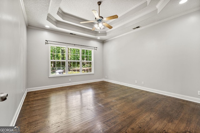 84 Creekside Ct, Zebulon, GA 30295 - unfurnished room with a ceiling fan, a textured ceiling, dark wood-style floors, ornamental molding, and a tray ceiling