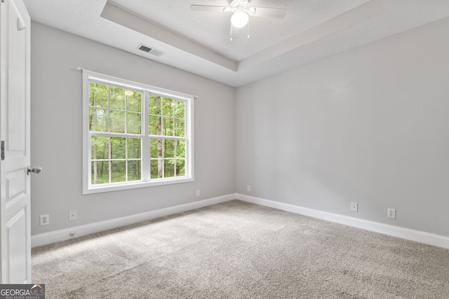 84 Creekside Ct, Zebulon, GA 30295 - carpeted spare room with baseboards, ceiling fan, and a raised ceiling