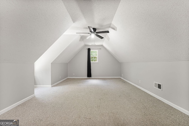 84 Creekside Ct, Zebulon, GA 30295 - bonus room featuring a textured ceiling, a ceiling fan, carpet floors, baseboards, and vaulted ceiling