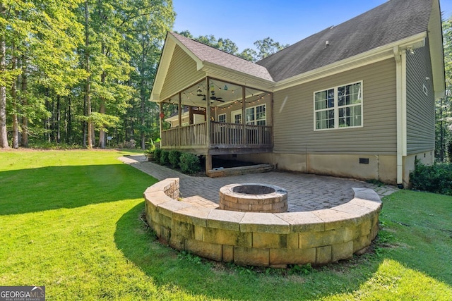 84 Creekside Ct, Zebulon, GA 30295 - rear view of house featuring a fire pit, a lawn, a ceiling fan, and a patio area