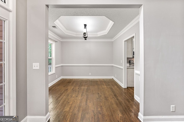 84 Creekside Ct, Zebulon, GA 30295 - spare room featuring a raised ceiling, dark wood-style floors, ornamental molding, and baseboards