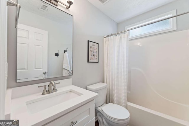 bathroom featuring toilet, vanity, and shower / bath combination with curtain