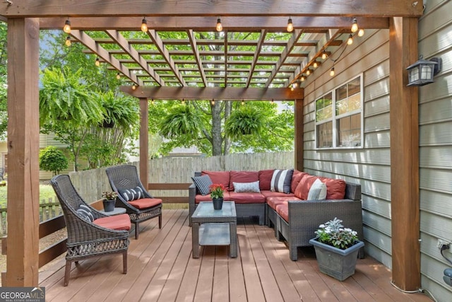 deck with outdoor lounge area, a pergola, and fence
