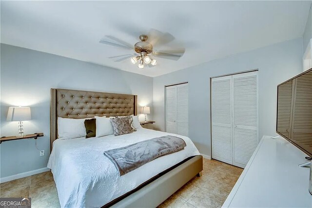 bedroom with multiple closets, ceiling fan, baseboards, and light tile patterned floors