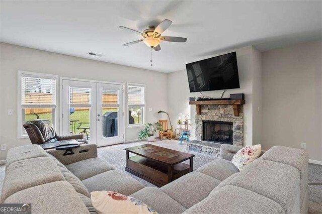 380 Longwood Pl, Dallas, GA 30132 - living room featuring carpet flooring, a ceiling fan, baseboards, and plenty of natural light