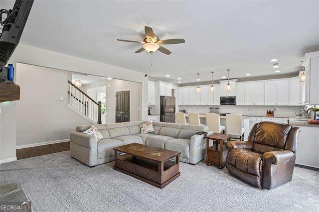 380 Longwood Pl, Dallas, GA 30132 - living room with ceiling fan, stairs, baseboards, and recessed lighting