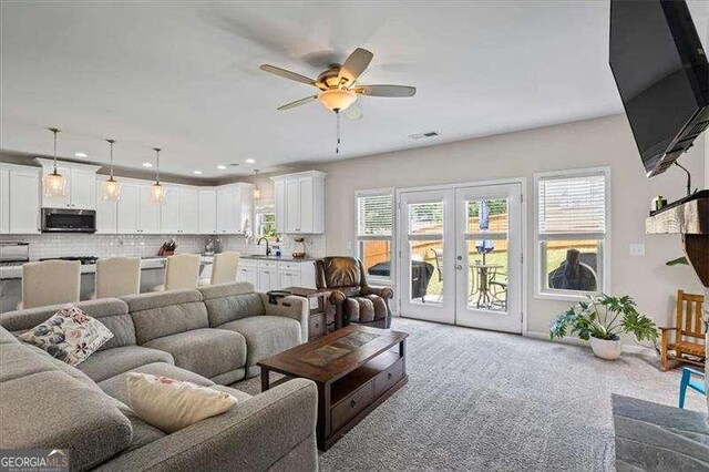 380 Longwood Pl, Dallas, GA 30132 - living area featuring french doors, ceiling fan, carpet flooring, and recessed lighting