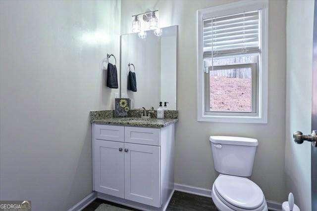 380 Longwood Pl, Dallas, GA 30132 - bathroom featuring toilet, vanity, and baseboards