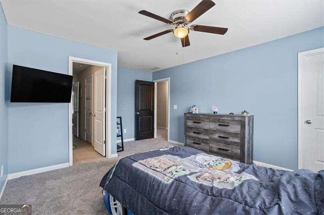 380 Longwood Pl, Dallas, GA 30132 - carpeted bedroom with baseboards and a ceiling fan
