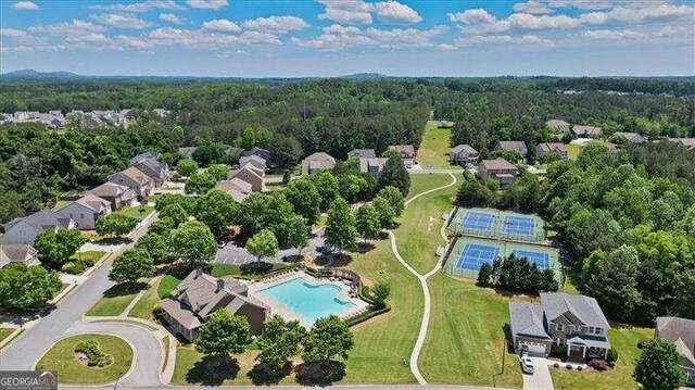 380 Longwood Pl, Dallas, GA 30132 - aerial perspective of suburban area with a pool area and a heavily wooded area