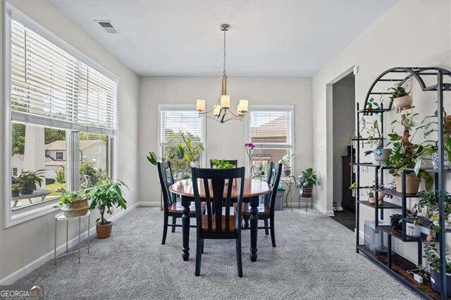 380 Longwood Pl, Dallas, GA 30132 - dining room featuring a chandelier, baseboards, and carpet