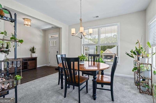 380 Longwood Pl, Dallas, GA 30132 - carpeted dining room featuring a chandelier and baseboards