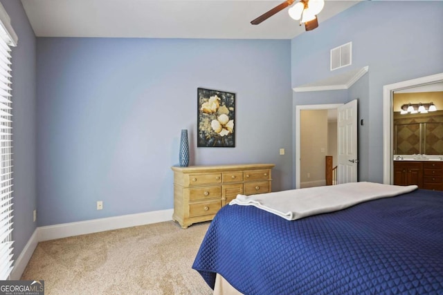 bedroom featuring light colored carpet, baseboards, ensuite bathroom, a ceiling fan, and high vaulted ceiling